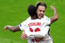 England's Raheem Sterling (left) celebrates scoring their side's first goal of the game with Jack Grealish during the UEFA Euro 2020 Group D match at Wembley Stadium, London. Picture date: Tuesday June 22, 2021.