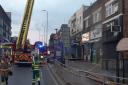 Ten fire engines and about 70 firefighters tackled a fire at a range of shops with flats above in Longbridge Road, Barking