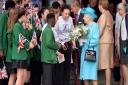 Queen Elizabeth II speaks with pupils during a tour of Sydney Russell School in Dagenham, east London, in 2015.