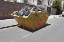The skip on the road in St Chad's Gardens in Chadwell Heath