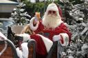 Santa donned his shades and enjoyed a drink after landing at Mecca Bingo Dagenham to launch 'Junemas'.