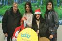 Jas Kallah with husband Sati, daughter Davina and sister Nerinder (right) donating chocolates to King George and Queen's Hospitals Charity.