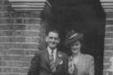 Violet Perkins and her husband, Bun, on their wedding day outside the house.