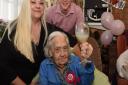 Lily White celebrating her 107th birthday at the Clover Cottage Care Home with Jillian Nicoll and Kevin Johnson.