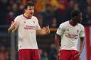 Harry Maguire, left, reacts after Galatasaray’s Kerem Akturkoglu scored his side’s third goal (AP)