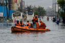 People were evacuated from flooded areas following heavy rains along the Bay of Bengal coast in Chennai (AP)