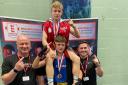 Dagenham Boxing Club's Tony Saunders hoists Billy Macey onto his shoulders after both won gold at the National Development Championships, with coaches Sean O’Sullivan and Lewis Passfield joining the celebrations