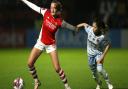 Arsenal's Frida Maanum (left) and West Ham United's Yui Hasegawa battle for the ball during the Barclays FA Women's Super League match at Meadow Park.