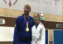 Judo gold medallist Chris Skelley with a pupil during the visit to All Saints Catholic School.