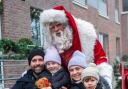 Santa Claus meets one of the families who visited Fielders Quarter at Barking Riverside for the Christmas event