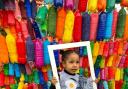 Esther Luke, 5, is one of the volunteers who helped paint plastic bottles for the sculpture