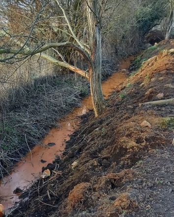 Discoloured water in a ditch close to the site. Image: Bellway