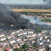 Drone picture of the blaze firefighters are fighting in Dagenham while they urge people to keep windows closed after a man and woman were taken to hospital suffering smoke inhalation