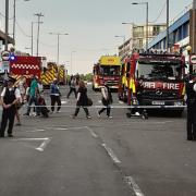 Eight fire engines and about 60 firefighters battled a fire at a shop with a flat above in Station Parade, Barking