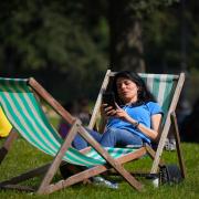 People enjoy the sun in St James's Park, London, last year. Parts of the UK could see an official heatwave in the coming days, forecasters have said