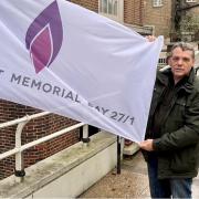 Cllr Darren Rodwell with the Holocaust Memorial Day flag