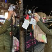 Victoria Burke and Melissa Page putting up hearts in Chadwell Heath