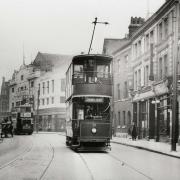 A tram running through Barking town centre.