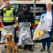 Barking and Dagenham Cllr Margaret Mullane and trading standards officers with seized cigarettes.