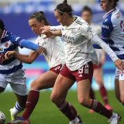 Reading's Danielle Carter, Arsenal's Katie McCabe, Caitlin Foord and Reading's Emma Harries battle for the ball sduring the FA Women's Super League match at Madejski Stadium, Reading.