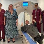 Cllr Darren Rodwell, Cllr Maureen Worby and medical staff around the recently installed mobile CT scanner at Barking Community Hospital