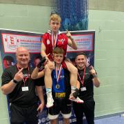 Dagenham Boxing Club's Tony Saunders hoists Billy Macey onto his shoulders after both won gold at the National Development Championships, with coaches Sean O’Sullivan and Lewis Passfield joining the celebrations