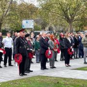 Wreaths are laid at Job Drain memorial statue in Barking on Remembrance Day