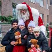 Santa Claus meets one of the families who visited Fielders Quarter at Barking Riverside for the Christmas event