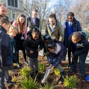 Children burying their 'time capsule' at Barking Abbey for future generations to find (pictrure: Melissa Page)
