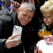 West Ham United Women's manager Paul Konchesky with a young fan