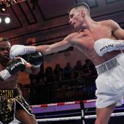 Billy Adams hits out on his professional debut. Image: Stephen Dunkley/Queensberry Promotions