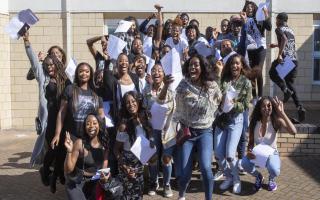 Pupils celebrate at Brampton Manor Academy as they receive their A Level results.