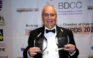 Farley Shelkin proudly holds the two awards won by his business Dagenham Travel